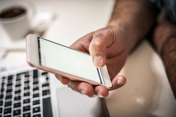 image of patient holding a phone