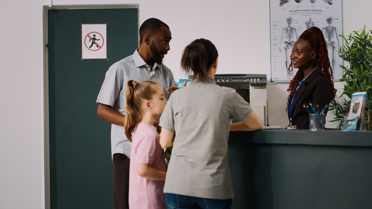 Image of patients visiting the reception desk